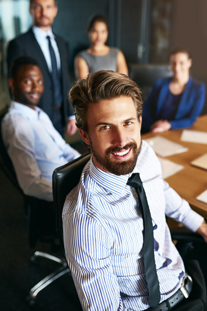 Portrait of a smiling businessman sitting in an office